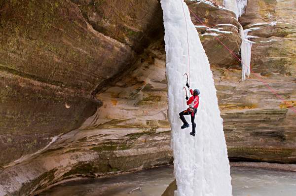 Person climbing ice waterfall